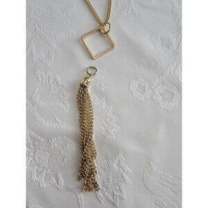Gold Colored Necklace with Diamond Shaped Pendant and Tassel